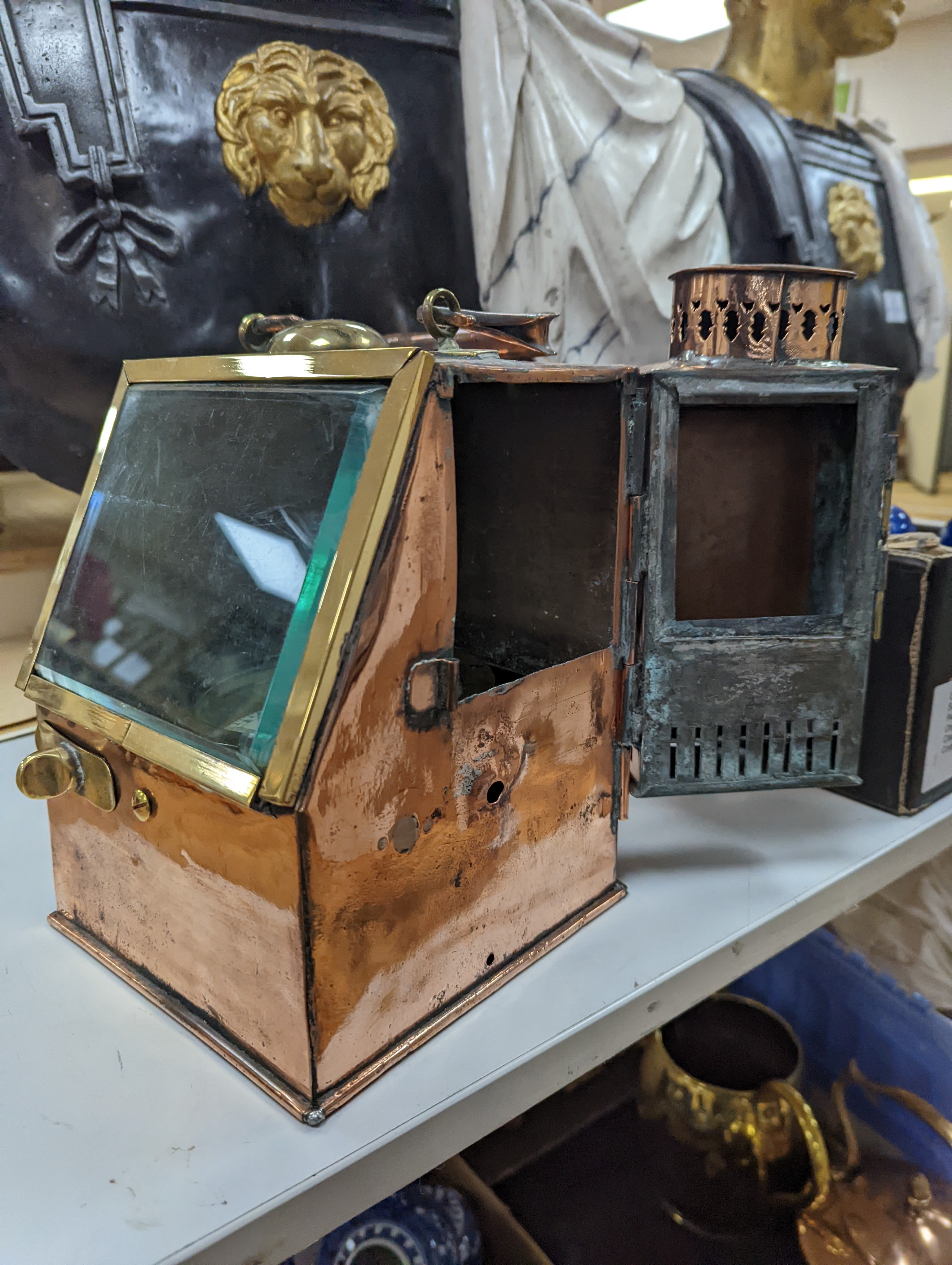 A copper ship's binnacle compass, a brass oil lamp, a brass jug and a copper kettle